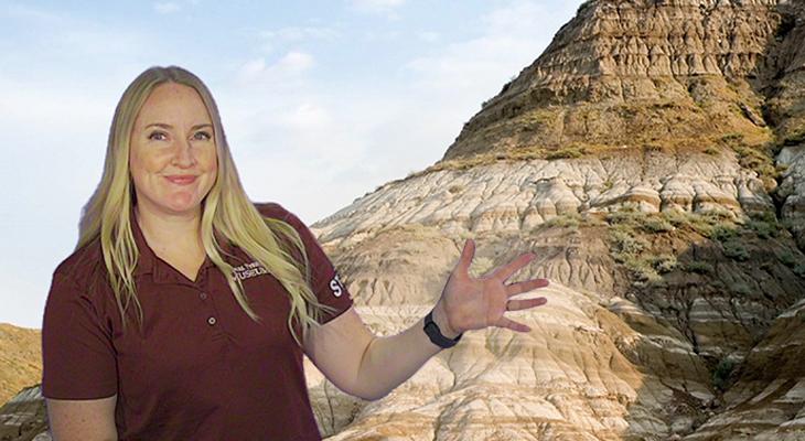 Science Educator in front of hills